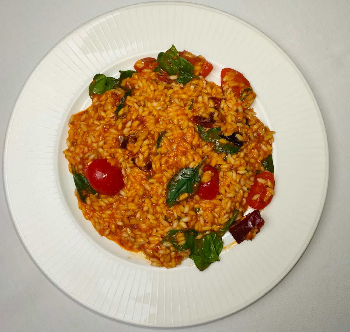 Risotto with Spinach and Spicy Pork Salami from Calabria